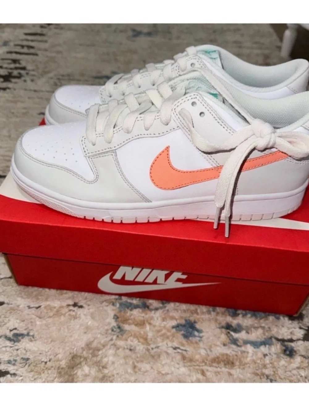 Nike White Low-Top Sneakers with Peach Swoosh
